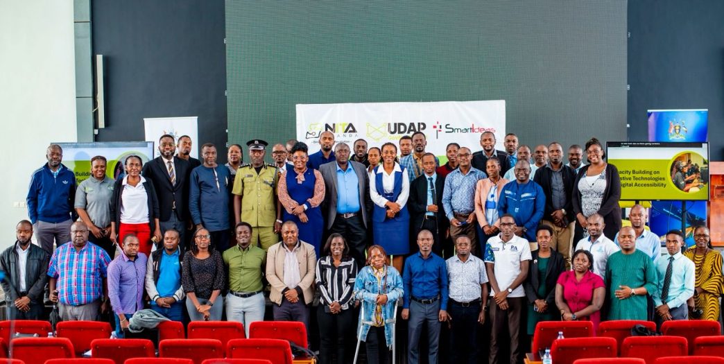 Officials from NITA-Uganda, Ministry of ICT & National Guidance, representatives from various government institutions, People with Disabilities that were trained in ICT skills programme, and other guests, pose for a group photo after a high-level stakeholder engagement to shape accessible digital future for Persons with Disabilities (PwDs). COURTESY PHOTO