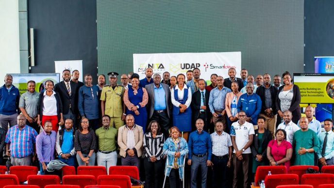 Officials from NITA-Uganda, Ministry of ICT & National Guidance, representatives from various government institutions, People with Disabilities that were trained in ICT skills programme, and other guests, pose for a group photo after a high-level stakeholder engagement to shape accessible digital future for Persons with Disabilities (PwDs). COURTESY PHOTO