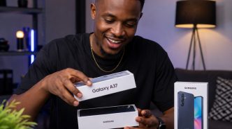A man pictured smiling while unboxing the Samsung Galaxy A37 5G. COURTESY PHOTO