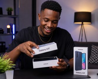 A man pictured smiling while unboxing the Samsung Galaxy A37 5G. COURTESY PHOTO