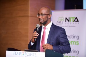 Dr. Hatwib Mugasa, Executive Director of NITA-Uganda, speaking at the launch of the updated National Information Security Framework (NISF) 2026, at Four Points by Sheraton in Kampala. COURTESY PHOTO