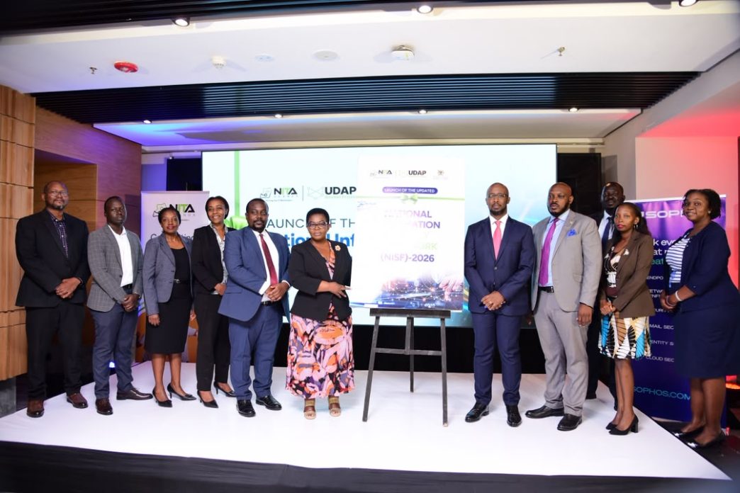Rt. Hon. Justine Lumumba (6th from left), and Dr. Hatwib (4th from right) Mugasa pose for a photo with NITA-Uganda officials after the launch of the Updated National Information Security Framework at Four Points by Sheraton in Kampala. COURTESY PHOTO