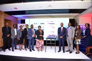 Rt. Hon. Justine Lumumba (6th from left), and Dr. Hatwib (4th from right) Mugasa pose for a photo with NITA-Uganda officials after the launch of the Updated National Information Security Framework at Four Points by Sheraton in Kampala. COURTESY PHOTO