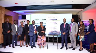 Rt. Hon. Justine Lumumba (6th from left), and Dr. Hatwib (4th from right) Mugasa pose for a photo with NITA-Uganda officials after the launch of the Updated National Information Security Framework at Four Points by Sheraton in Kampala. COURTESY PHOTO