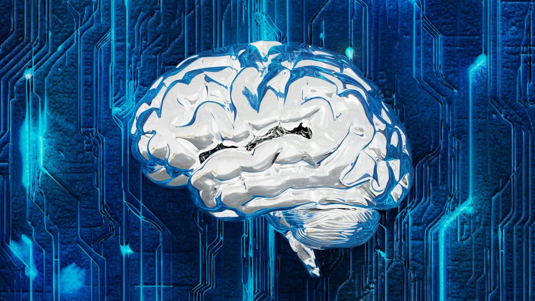 A computer circuit board designed in the shape of a human brain, representing artificial intelligence.