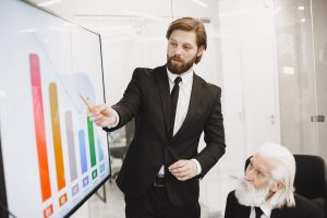 Business leaders reviewing a unified data dashboard in a meeting