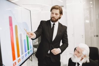 Business leaders reviewing a unified data dashboard in a meeting