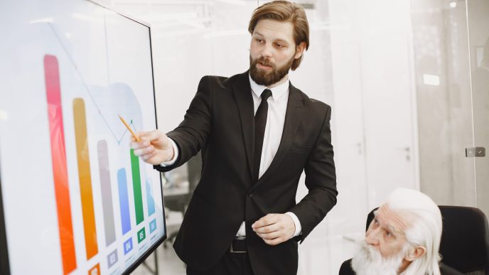 Business leaders reviewing a unified data dashboard in a meeting