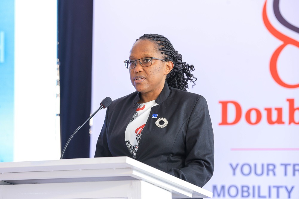 Kate Kiiza, Executive Director and Chief Corporate and Institutional Banking Officer at DFCU Bank, speaking during a partnership announcement with Double Q and ICEA LION General Insurance to make new commercial vehicles more accessible. COURTESY PHOTO