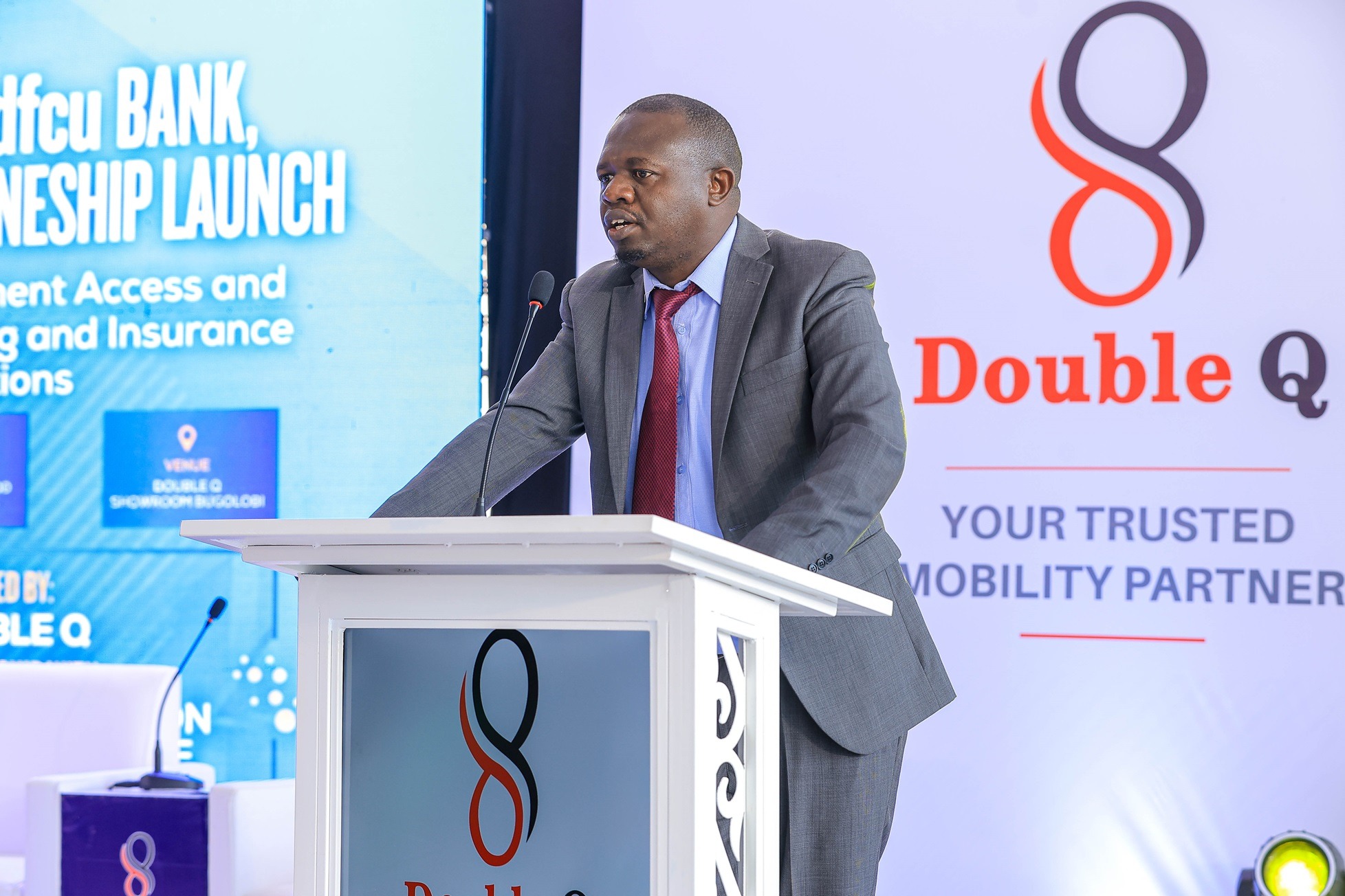 Richard Musani, Head of Marketing at Double Q Company Limited, speaking during a partnership announcement with DFCU Bank and ICEA LION General Insurance to make new commercial vehicles more accessible. COURTESY PHOTO