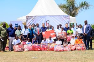Double Q team poses for a group photo with school students in Kalungu District. COURTESY PHOTO