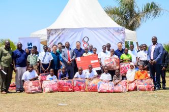 Double Q team poses for a group photo with school students in Kalungu District. COURTESY PHOTO